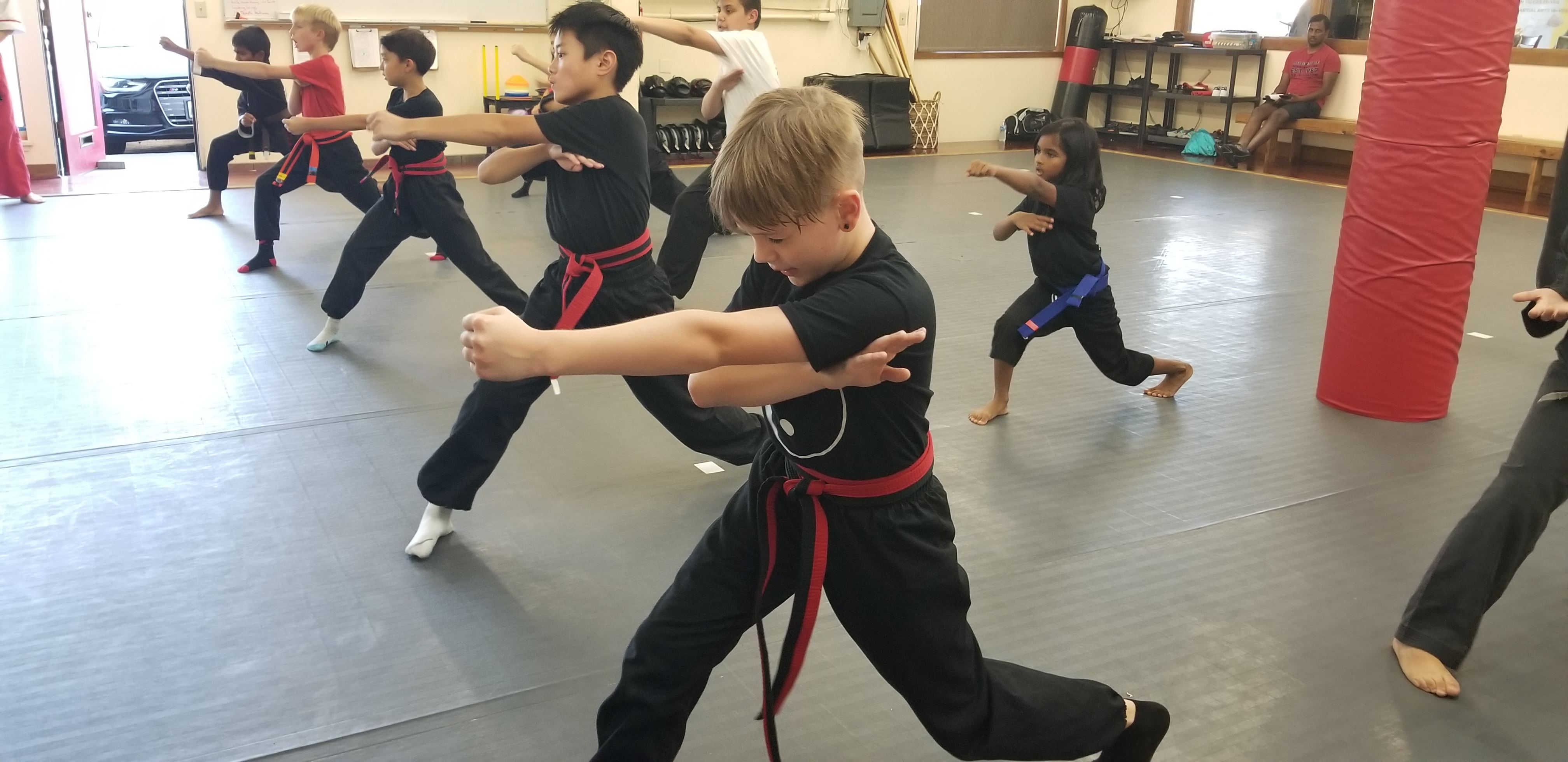 kids doing karate is a class at the academy of kempo martial arts image